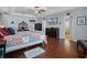 Comfortable main bedroom with ensuite bath, tray ceilings, and a ceiling fan at 11126 Oakshore Ln, Clermont, FL 34711