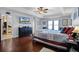 Spacious main bedroom with dark wood floors, trey ceilings, and ample closet space at 11126 Oakshore Ln, Clermont, FL 34711