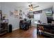 Spacious office featuring hardwood floors, complemented by two workstations, and natural light at 11126 Oakshore Ln, Clermont, FL 34711