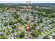 Beautiful aerial view of the property showcasing its location near Spanish Springs Town Square and a tranquil lake at 1202 Del Toro Dr, Lady Lake, FL 32159