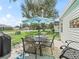 A backyard featuring patio furniture and a large shade umbrella at 1202 Del Toro Dr, Lady Lake, FL 32159