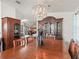 Charming dining room with a spacious table, elegant lighting, and ample storage, perfect for Gathering gatherings at 1202 Del Toro Dr, Lady Lake, FL 32159