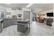 Bright eat-in kitchen featuring gray cabinets, modern appliances, and tile flooring at 1202 Del Toro Dr, Lady Lake, FL 32159