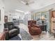 Open-concept living room with view to kitchen and comfortable seating at 1202 Del Toro Dr, Lady Lake, FL 32159