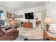 Relaxing living room with light wood floors and TV at 1202 Del Toro Dr, Lady Lake, FL 32159