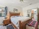 Comfortable bedroom featuring a wooden bed frame and simple decor at 1202 Del Toro Dr, Lady Lake, FL 32159