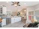 Spacious kitchen featuring stainless appliances, gray countertops, and an open layout perfect for entertaining at 12401 Blue Heron Way, Leesburg, FL 34788