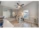 Bright office with natural light features white walls, wood floors, and built-in shelving at 12401 Blue Heron Way, Leesburg, FL 34788