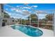 Inviting screened pool with ample seating area, perfect for relaxing and entertaining outdoors at 12401 Blue Heron Way, Leesburg, FL 34788