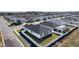 This aerial view showcases a single-Gathering home, with a well-maintained lawn, a backyard, and neighborhood at 12624 Ne 49Th Dr, Oxford, FL 34484