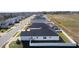 Aerial view of a home with a fenced backyard, showcasing the surrounding community and neighborhood at 12624 Ne 49Th Dr, Oxford, FL 34484
