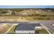 Aerial view of the home, showing the backyard and surrounding community at 12624 Ne 49Th Dr, Oxford, FL 34484