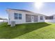 This home features a spacious backyard with a screened-in patio, perfect for outdoor entertaining at 12624 Ne 49Th Dr, Oxford, FL 34484