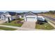 This single-Gathering home has beautiful landscaping, three-car garage, and a brick paver driveway at 12624 Ne 49Th Dr, Oxford, FL 34484
