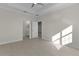 Spacious main bedroom offers an ensuite bathroom and ample sunlight at 12624 Ne 49Th Dr, Oxford, FL 34484
