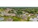 Aerial view of a residential area featuring well-kept lawns and beautiful green trees at 12687 Se 90Th Ter, Summerfield, FL 34491