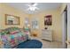 Cozy bedroom with a cheerful color scheme, featuring a comfortable daybed and natural light at 12687 Se 90Th Ter, Summerfield, FL 34491