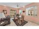 Cozy dining area features a glass table, floral couch and views of the screened-in patio at 12687 Se 90Th Ter, Summerfield, FL 34491