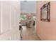 Foyer with views to living room featuring a ceiling fan and ceramic tile floors at 12687 Se 90Th Ter, Summerfield, FL 34491
