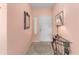 Foyer with views of the front door leading to a small rug and table at 12687 Se 90Th Ter, Summerfield, FL 34491