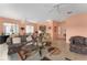 Large living room with an open floor plan, ceramic tile flooring, and a comfortable seating area at 12687 Se 90Th Ter, Summerfield, FL 34491