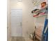 Clean utility room with shelving, a door and a beige rug at 12687 Se 90Th Ter, Summerfield, FL 34491