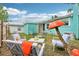 Cozy backyard with a patio set, artificial mushroom and well-maintained lawn at 1301 North Ave, Tavares, FL 32778