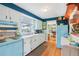 Charming kitchen with vintage appliances, ample cabinet space, and hardwood floors at 1301 North Ave, Tavares, FL 32778