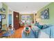 Cozy living room with hardwood floors, comfortable seating, and tasteful decor at 1301 North Ave, Tavares, FL 32778