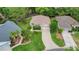 Aerial view of home shows a lush, green lawn with mature trees and landscaping at 13050 Se 89Th Cir, Summerfield, FL 34491