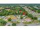 Neighborhood aerial view shows the home in a cul-de-sac surrounded by mature trees and well-maintained landscaping at 13050 Se 89Th Cir, Summerfield, FL 34491