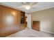 Bedroom featuring carpet, a Murphy bed, and built-in storage and cabinets at 13050 Se 89Th Cir, Summerfield, FL 34491