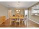 Open dining room features hardwood floors, ample space, and convenient access to the kitchen at 13050 Se 89Th Cir, Summerfield, FL 34491