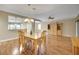 Formal dining room with hardwood floors, a chandelier and a custom-built display cabinet at 13050 Se 89Th Cir, Summerfield, FL 34491