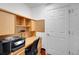 Dedicated office space with built-in desk and shelving; ideal for remote work at 13050 Se 89Th Cir, Summerfield, FL 34491