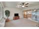 Bright sunroom featuring sliding glass doors offering a view into the living and dining rooms at 13050 Se 89Th Cir, Summerfield, FL 34491