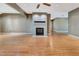 Finished basement features a brick fireplace and hardwood flooring, perfect for entertaining or relaxation at 1341 W Lakeshore Dr, Clermont, FL 34711
