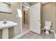 Bathroom with single sink and access to a shower and private toilet at 1341 W Lakeshore Dr, Clermont, FL 34711