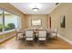 Formal dining room featuring wood floors, a large window, and elegant decor for gatherings at 1341 W Lakeshore Dr, Clermont, FL 34711