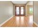 Inviting foyer with gleaming wood floors and views to adjacent rooms, creating a sense of openness at 1341 W Lakeshore Dr, Clermont, FL 34711