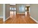 Spacious interior hallway with wood floors and access to living areas offering seamless flow at 1341 W Lakeshore Dr, Clermont, FL 34711
