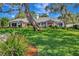 Expansive lawn and beautiful landscaping surrounding this well-maintained home at 1341 W Lakeshore Dr, Clermont, FL 34711