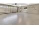 Clean and spacious garage with painted floors, ample lighting, and an automatic door opener at 1341 W Lakeshore Dr, Clermont, FL 34711