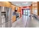Updated kitchen with stainless steel appliances, granite countertops, and wood cabinets at 1341 W Lakeshore Dr, Clermont, FL 34711