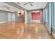 Open-concept living area featuring natural light and hardwood floors throughout the home at 1341 W Lakeshore Dr, Clermont, FL 34711