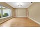 Bright living room featuring hardwood floors, natural light, and neutral paint at 1341 W Lakeshore Dr, Clermont, FL 34711