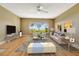 Bright living room with large windows overlooking lush greenery and waterfront views at 1341 W Lakeshore Dr, Clermont, FL 34711