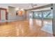 Spacious living room with hardwood floors, access to the kitchen and beautiful backyard views at 1341 W Lakeshore Dr, Clermont, FL 34711