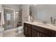Beautiful bathroom featuring a double sink vanity, glass shower, and neutral tiling at 14430 Desert Haven St # 4302, Windermere, FL 34786