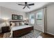 Inviting bedroom featuring a queen-size bed, wood floors, and ample natural light at 14430 Desert Haven St # 4302, Windermere, FL 34786